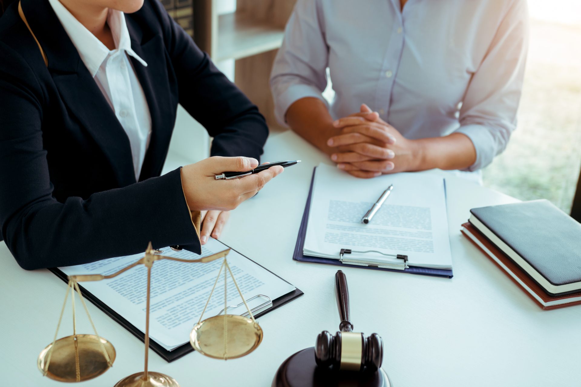 Lawyer discussing with client in his office