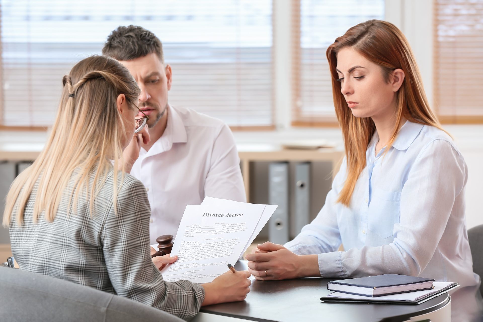 Lawyer discussing with clients in office